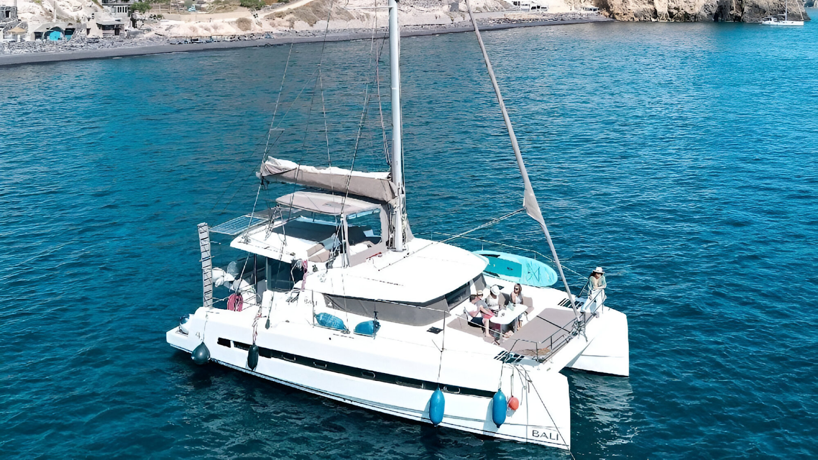 A luxury boat rental docked on the waters in Santorini 