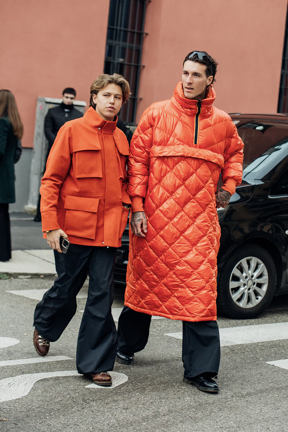 Picture showing a  two  guys rocking an orange theme for the event