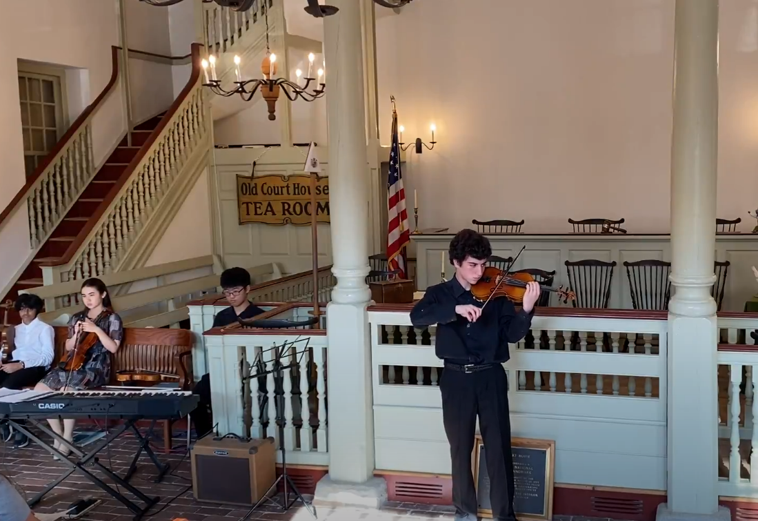 Students from Delaware Music School perform traditional pieces from the Colonial era.