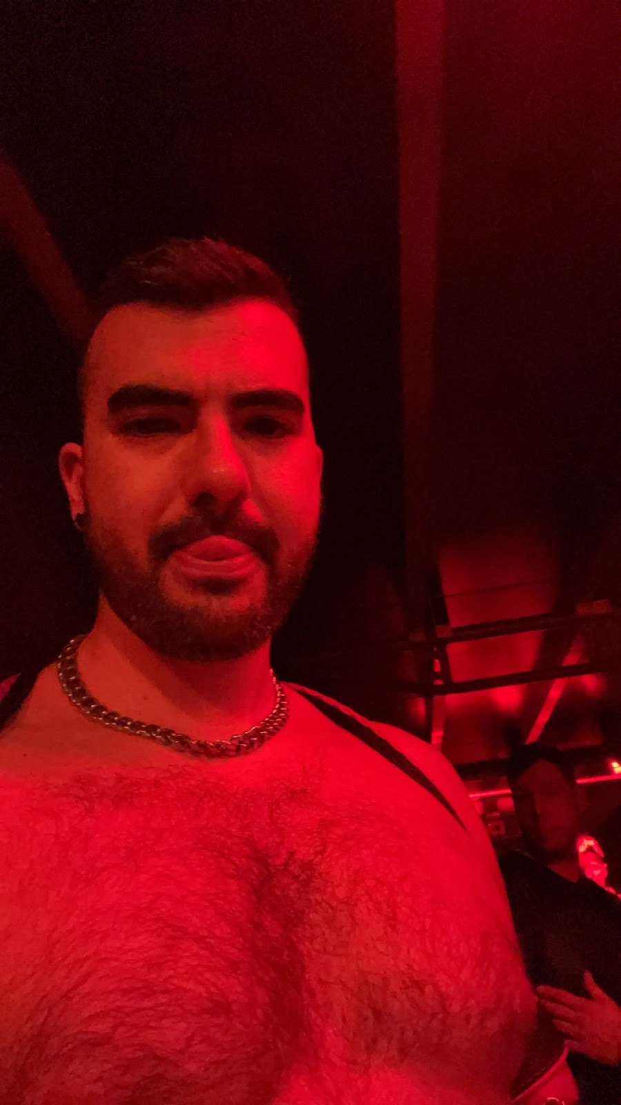 onlyfans gay content creator Phil taking a selfie on the dancefloor of darklands 2024 in Belgium