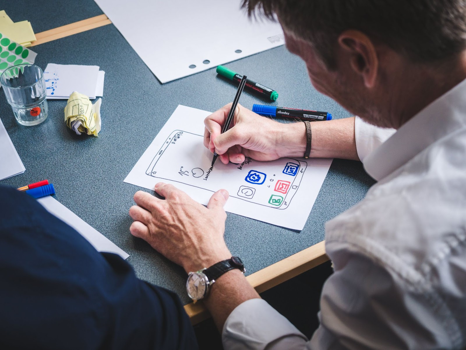 image of UX designer drawing a wireframe