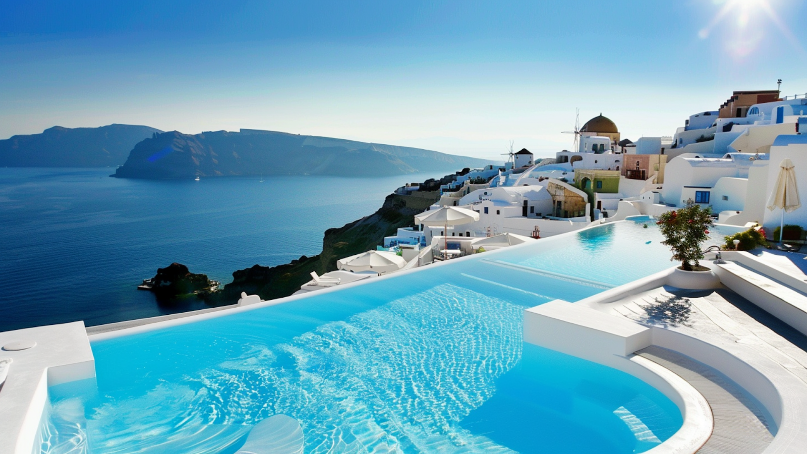 A pool overlooking the Aegean Sea of a summer home rental in Santorini