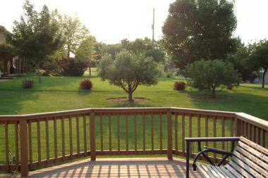 tips for choosing the best deck railing for your build outdoor bench overlooking foliage custom built michigan
