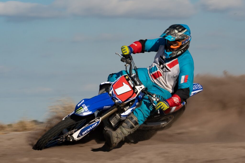 person riding on dirt bike close-up photography
