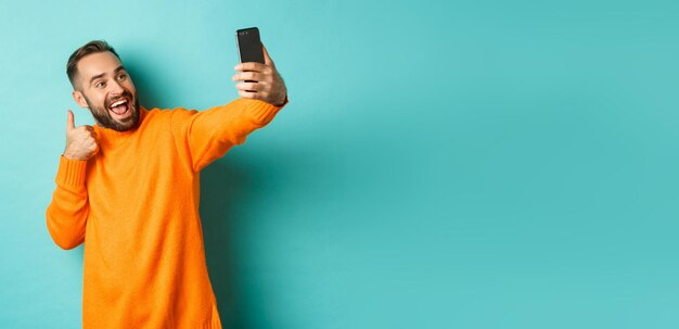 A Man is Taking a Selfie in Happy Mood