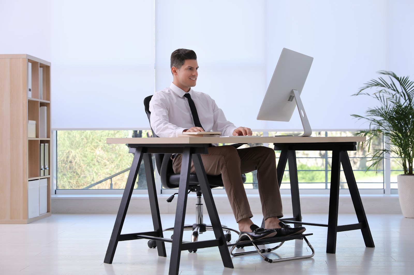 A man working while sitting on a comfortable office chair