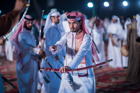 An Arabian man holding a sword