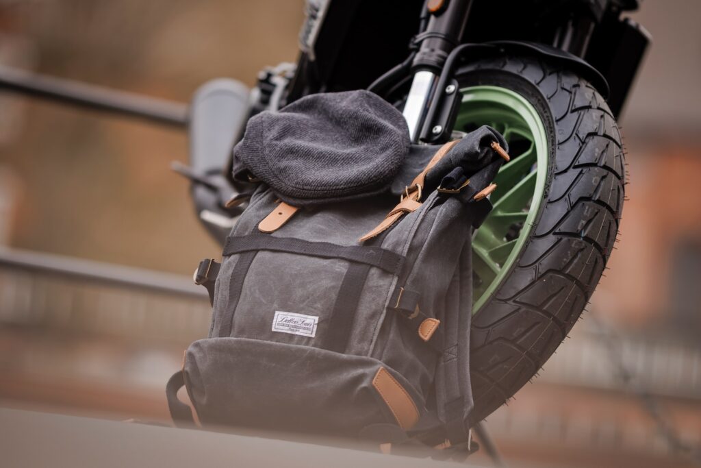 a back pack sitting on top of a motorcycle