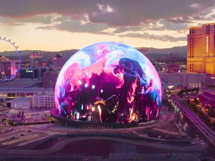 the venetian las vegas 13 
A giant glowing dome with a wheel and a large hotel in the background