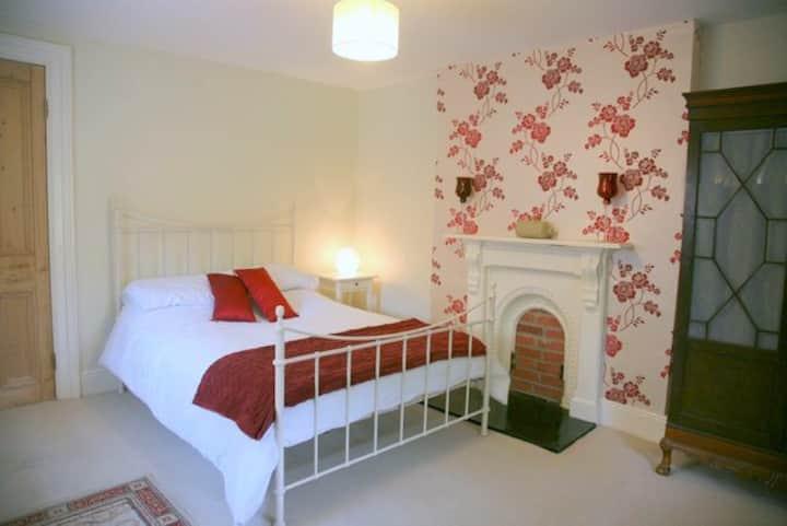 Red bedroom with double bed