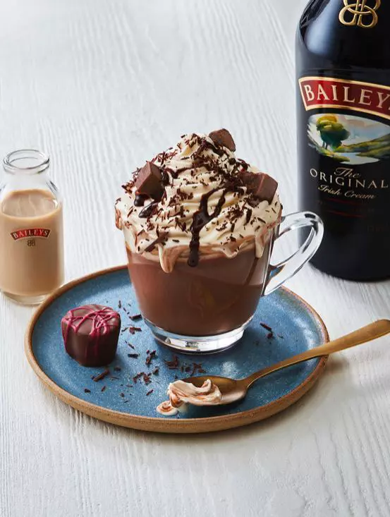 A picture of a cup of Bailey's hot chocolate, perfect for a board game party.