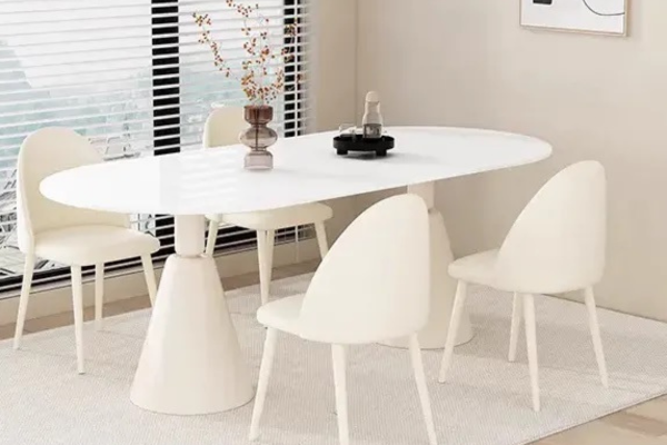 White sintered stone oval 4-seater dining table with a cone base