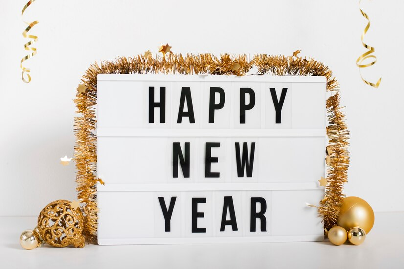 A happy new year sign with decorations.