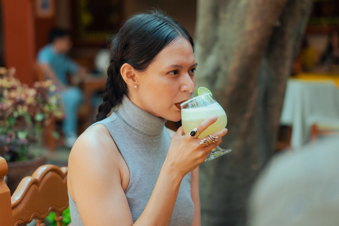 Woman Sipping a Drink