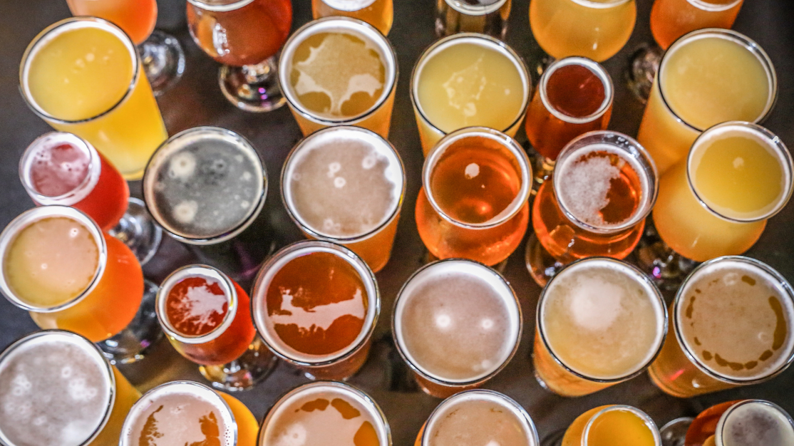 Table top covered with glasses of beer