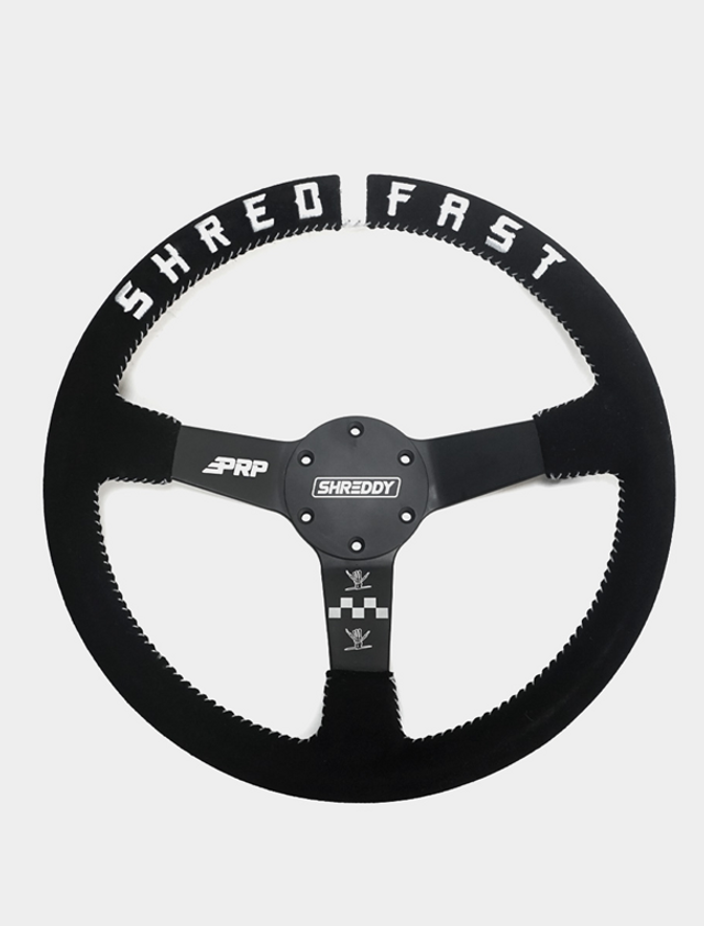 A Kubota RTV Sidekick Shred Steering Wheel, pictured uninstalled and against a blank background.