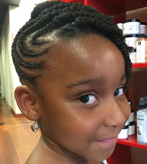 Picture of a girl rocking side cornrows and twist