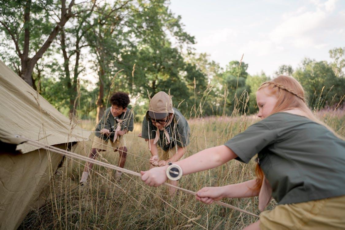 Free Photograph of Kids Setting Up a Tent Stock Photo