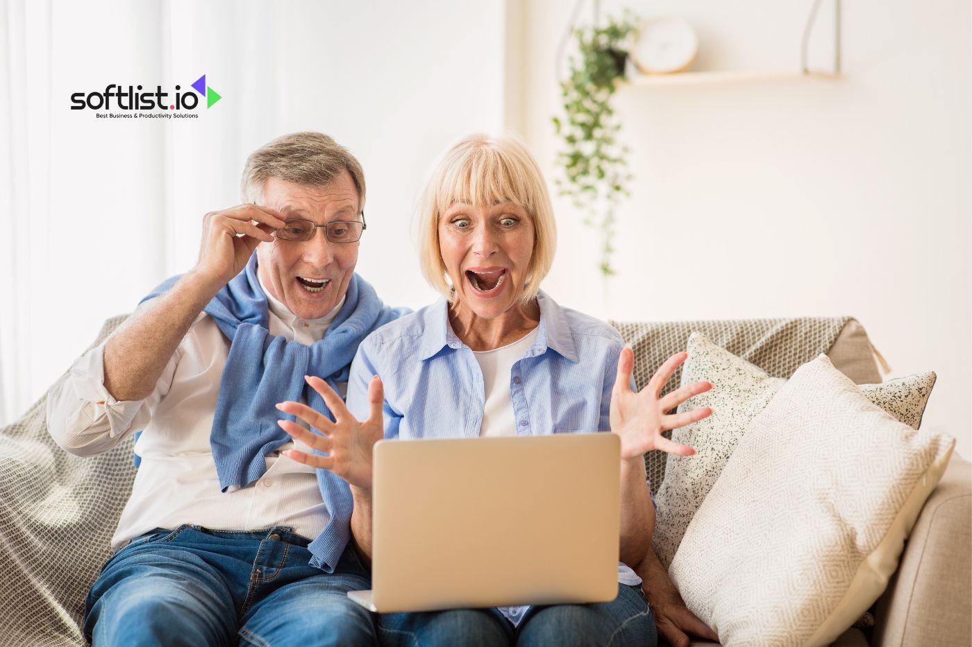 surpised old couple while looking their laptop