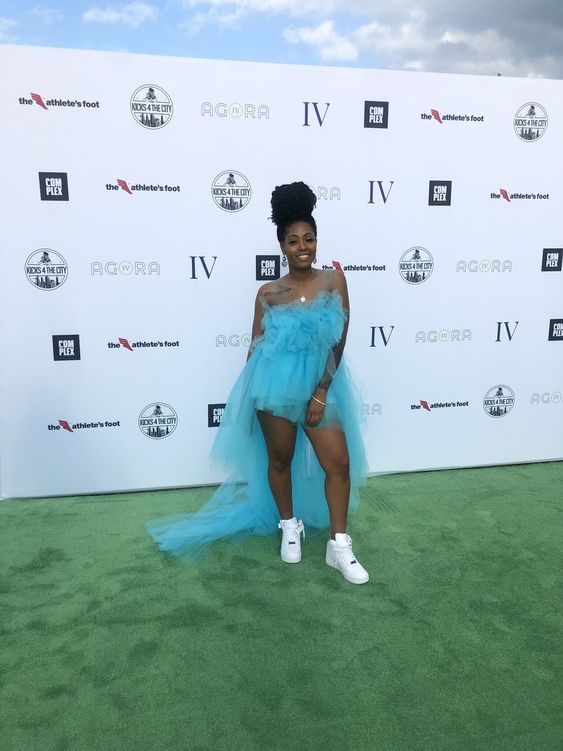 Picture of a lady rocking the tulle with  a sneakers