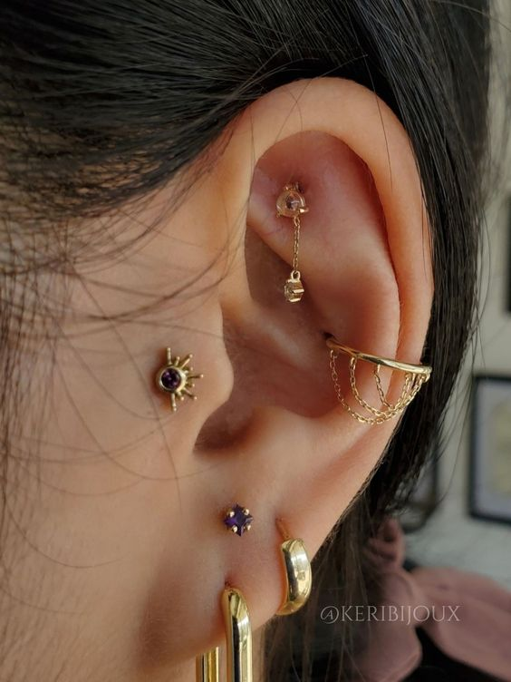 Full picture of a lady rocking the rook piercing in style