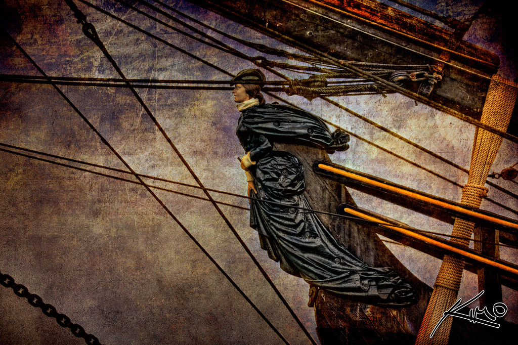 Bounty HMS Figurehead - a black cloth hanging from a wooden pole