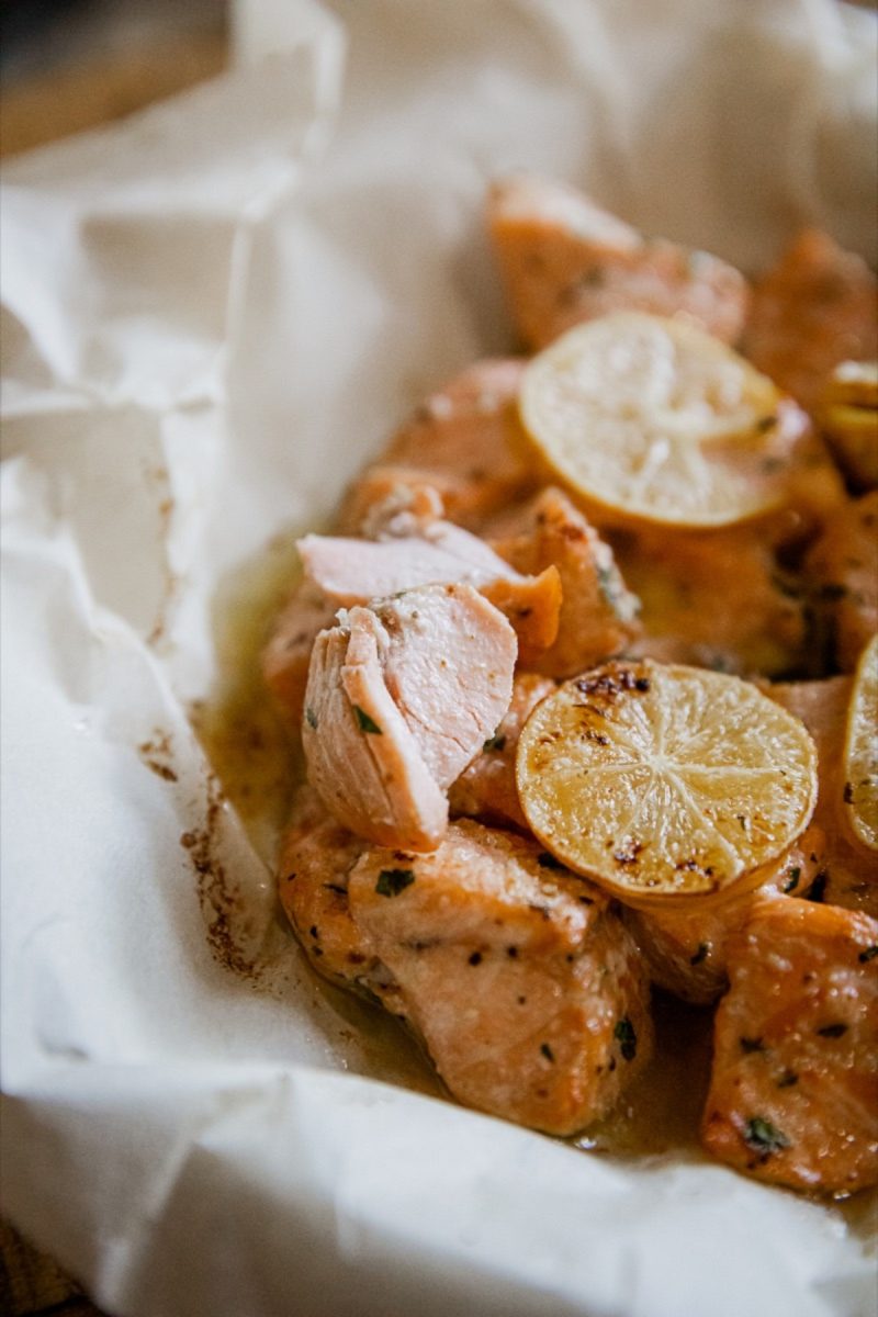 Air fryer salmon bites on a piece of paper.