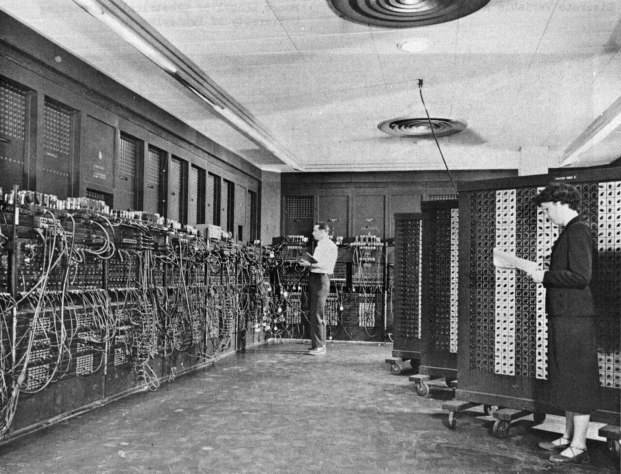 A photo of two programmers working on ENIAC, the world's first programmable computer
