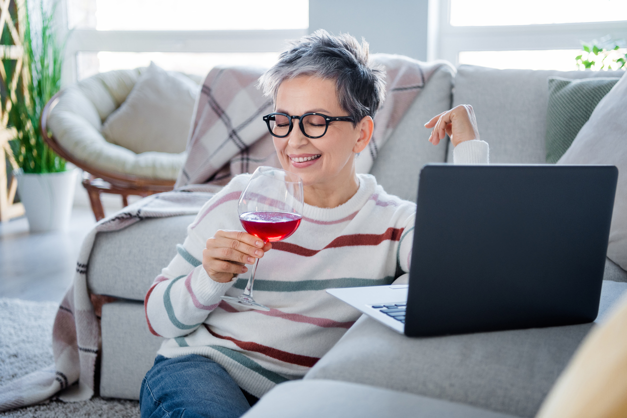 Senior with a glass of wine