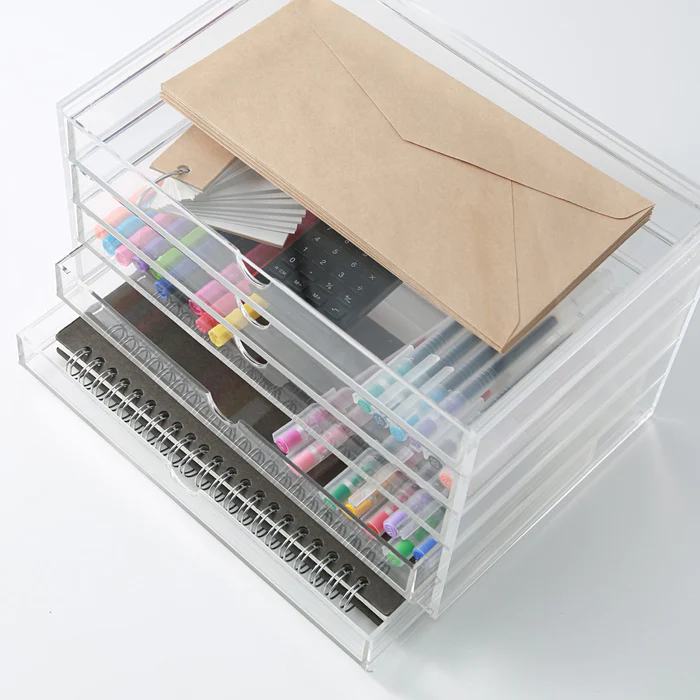 Muji Acrylic Organizer: Crafted from transparent acrylic, this organizer offers convenient storage, allowing you to easily see and access the items you need.