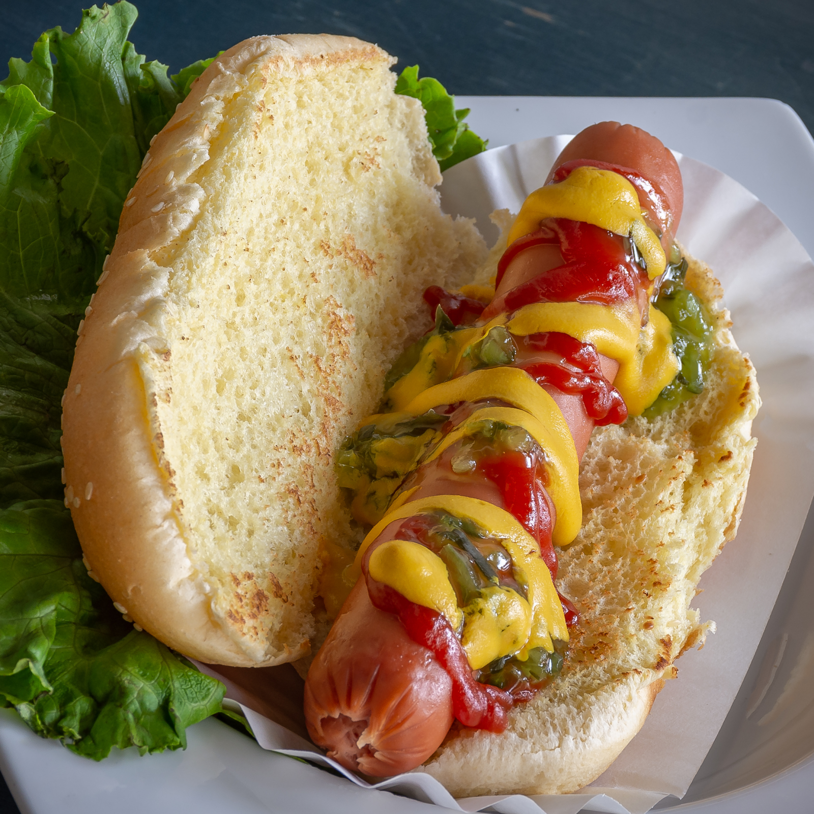hot dog with mustard, ketchup and relish