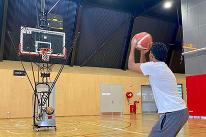 A man training how to shoot properly using a shooting machine