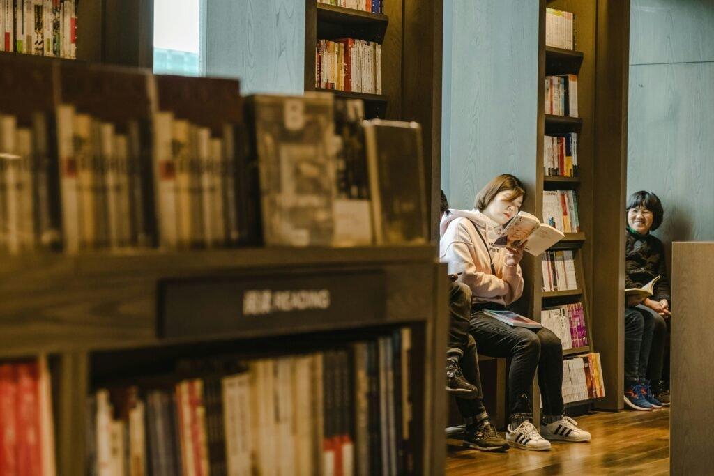 woman leaning and reading a book - Best Study Methods For Memorization