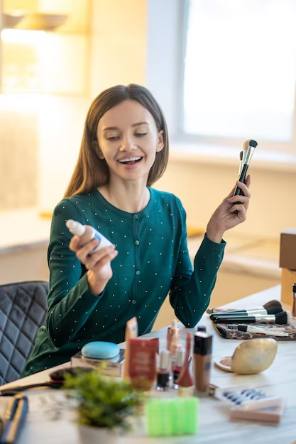 A Girl is Looking Her Makeup Products Happily 