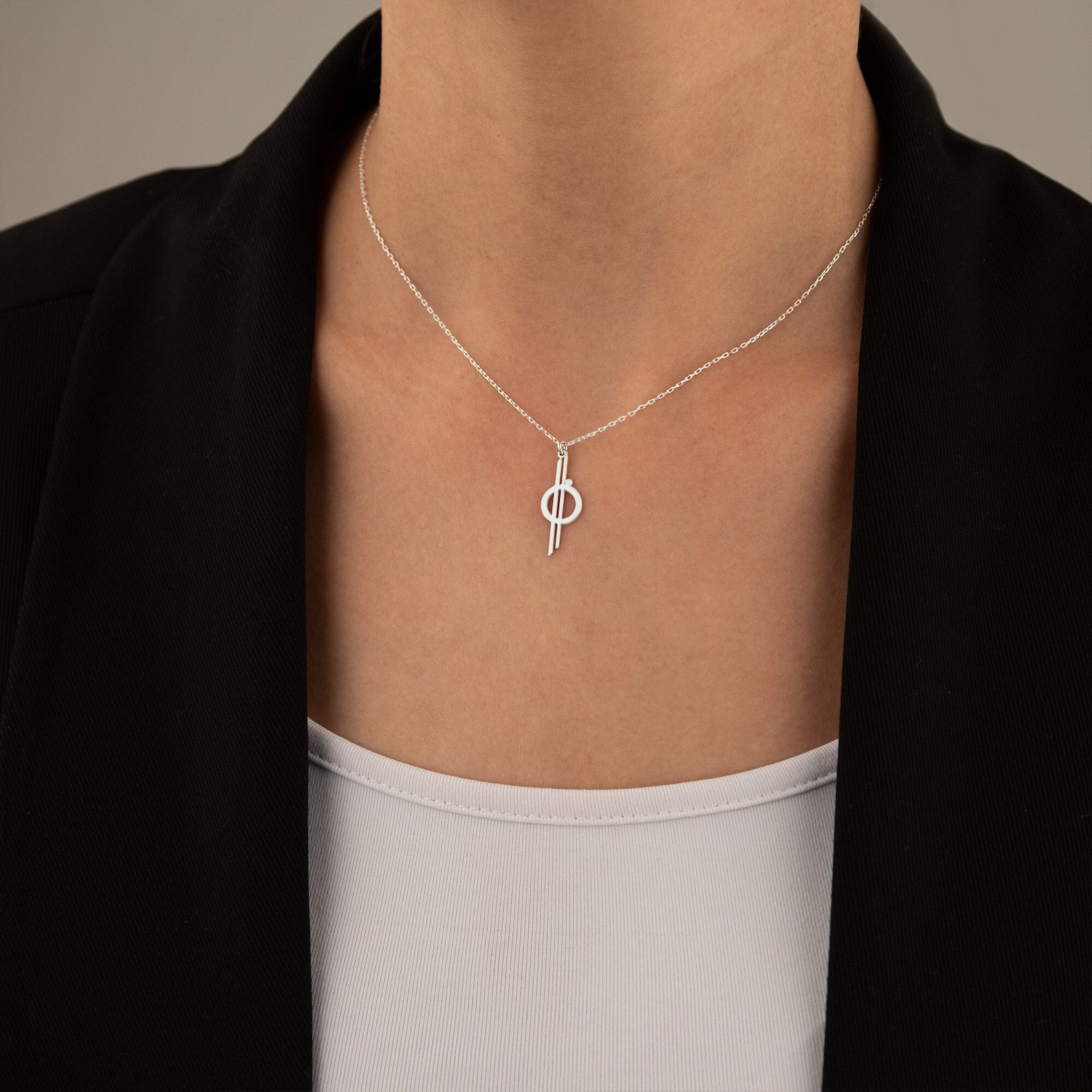 A silver minimalistic Halycon star cruiser necklace