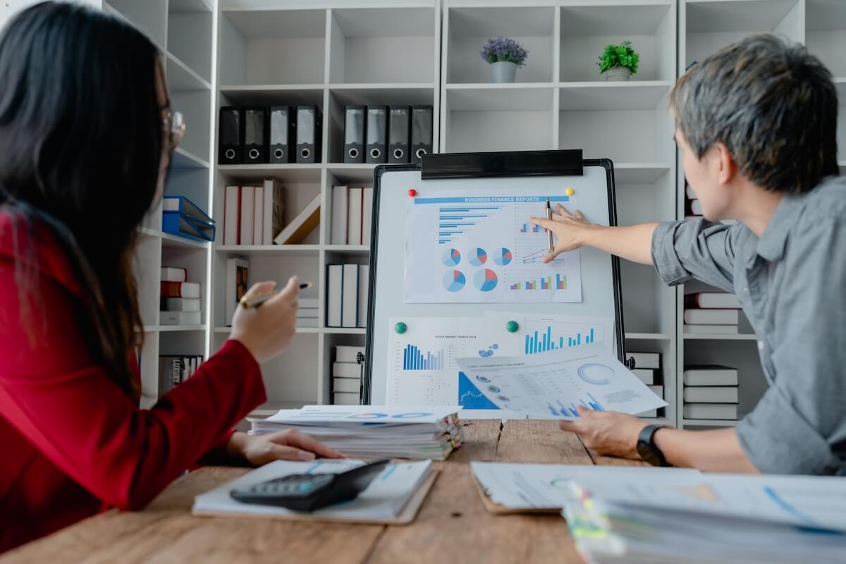 Performance improvement plan: entrepreneurs discussing graphs and data