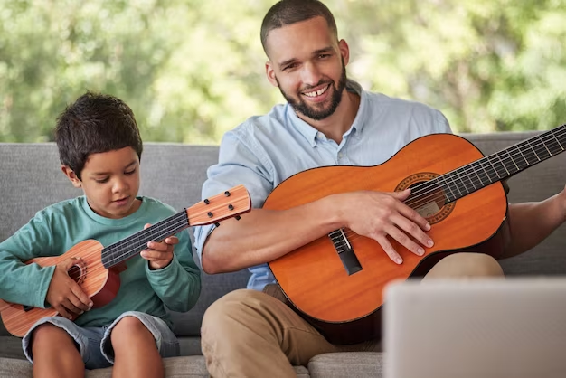 Father and Son Playing Guitar And Spending Quality Time