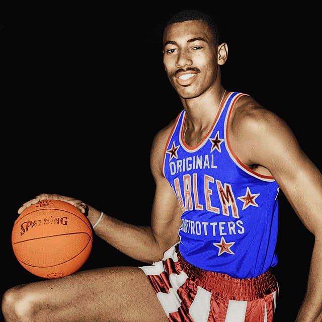 spotcovery-Wilt Chamberlain holding a ball-all-time scoring list in the NBA