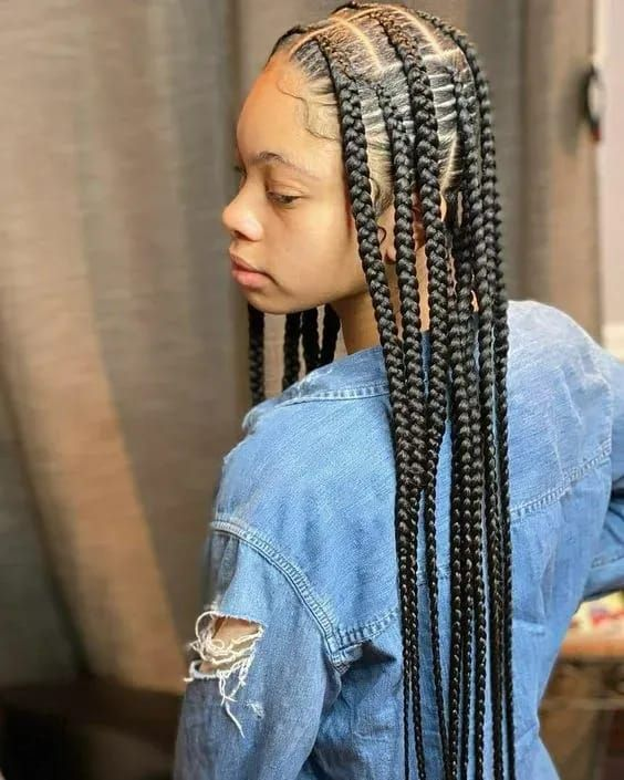 Picture of a lady on jean rocking the pop smoke braids