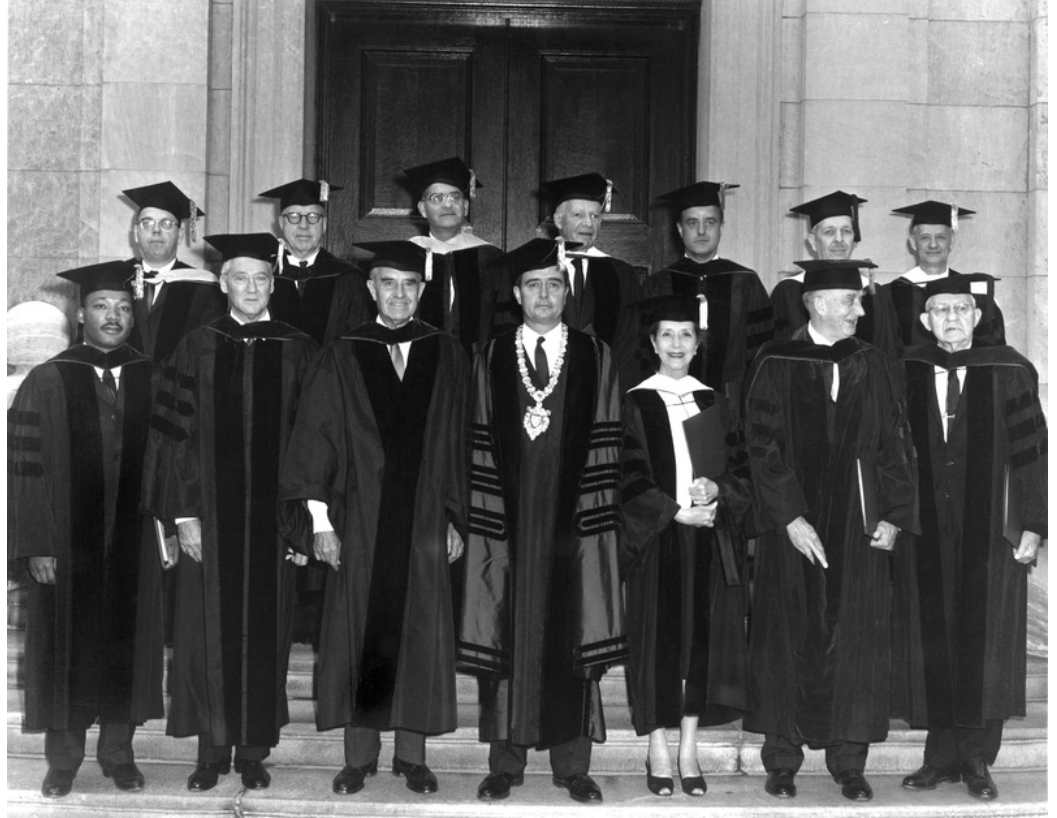 A group of people in graduation gowns

Description automatically generated with medium confidence
