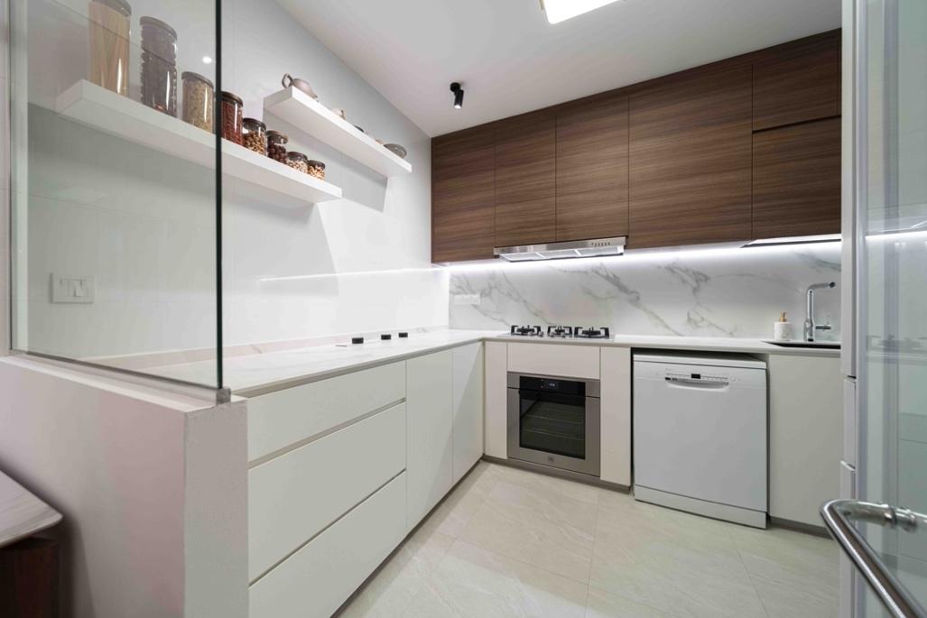 A kitchen with white cabinets and a glass partition

Description automatically generated