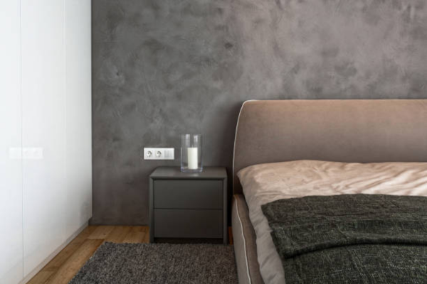 Grey bedroom with bedside table