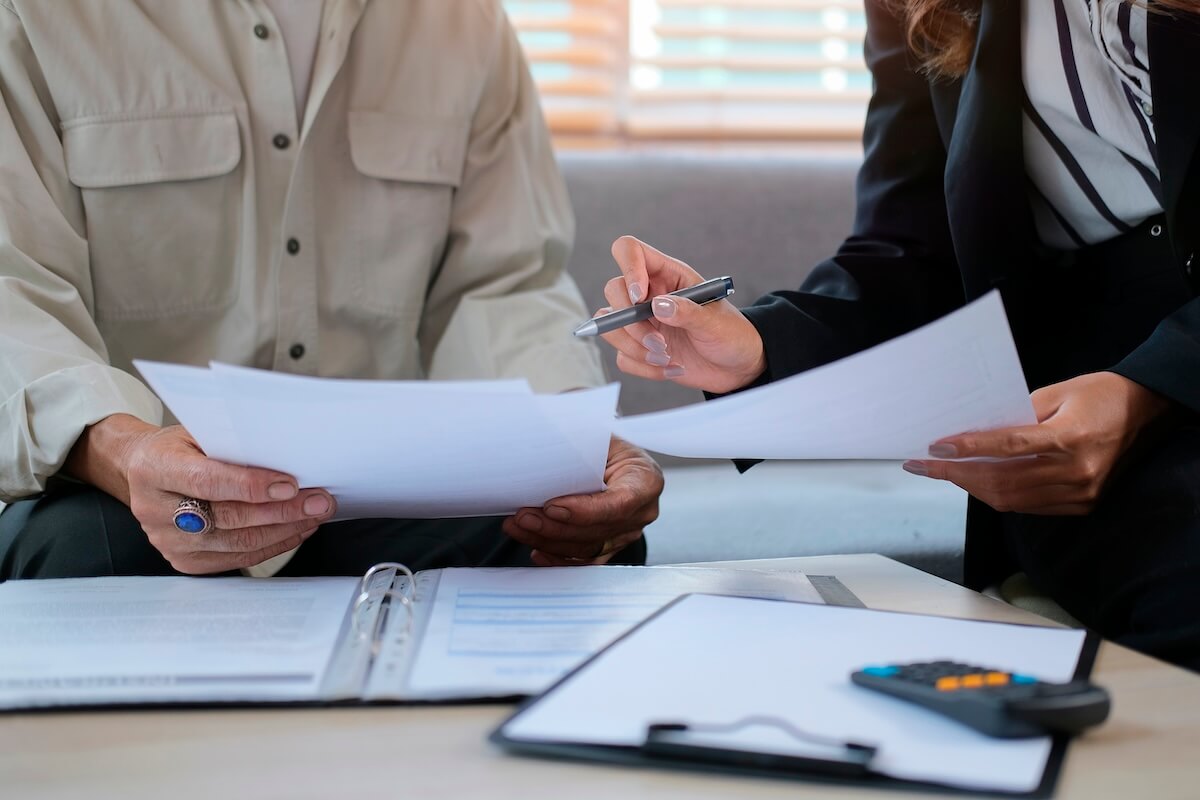 Life cycle of a claim: financial advisor showing some documents to her client