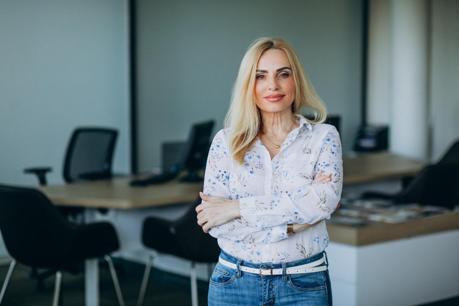 a woman standing in an office