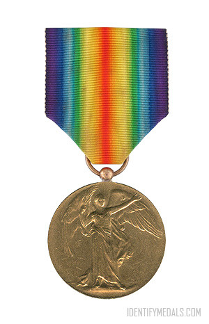 A rainbow colored medal with a medal on it

Description automatically generated