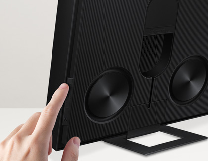 Finger pressing the Pair button on a Samsung Music Frame speaker