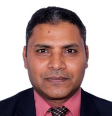 A person in a suit and tie

Description automatically generated