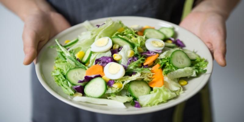 A plate of salad with eggs and vegetables

Description automatically generated