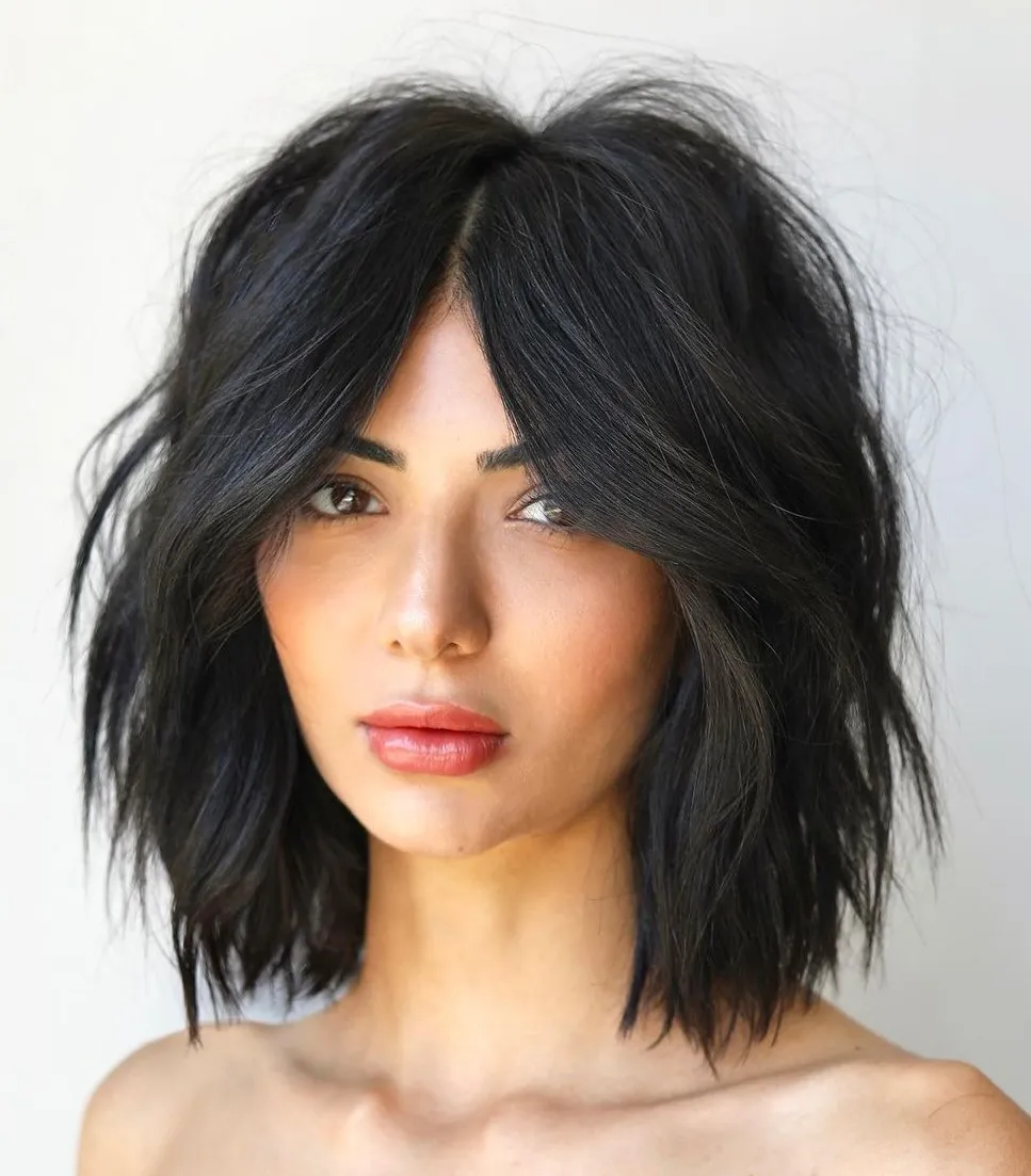 Picture of a lady wearing  Curtain Bangs With Short Choppy Layers 