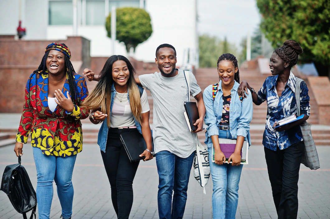 Friends hanging out and laughing together on campus.